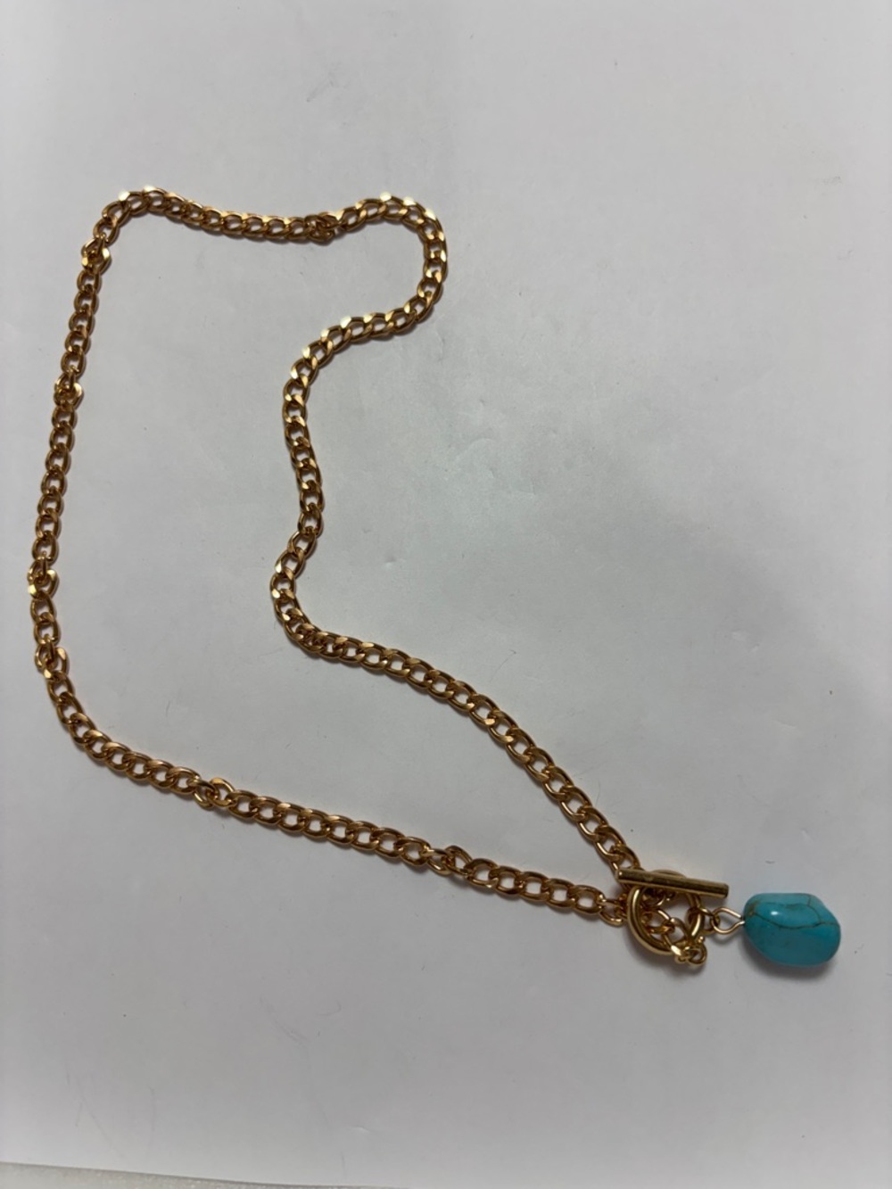 18” brass plated necklace with hematite pendant.